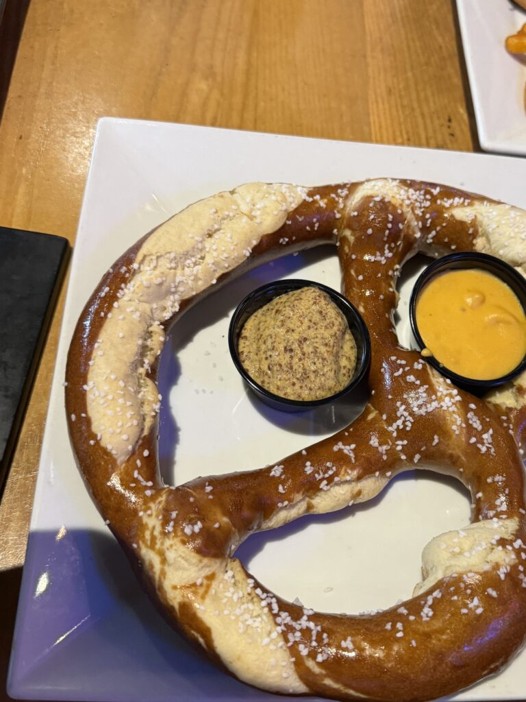 pretzel with mustard and beer cheese
